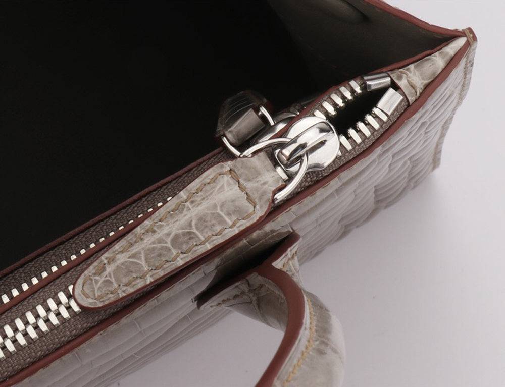 Rossie Viren beaded crocodile skin leather handbag with shiny finish, cross body strap, and top handle for stylish carry.