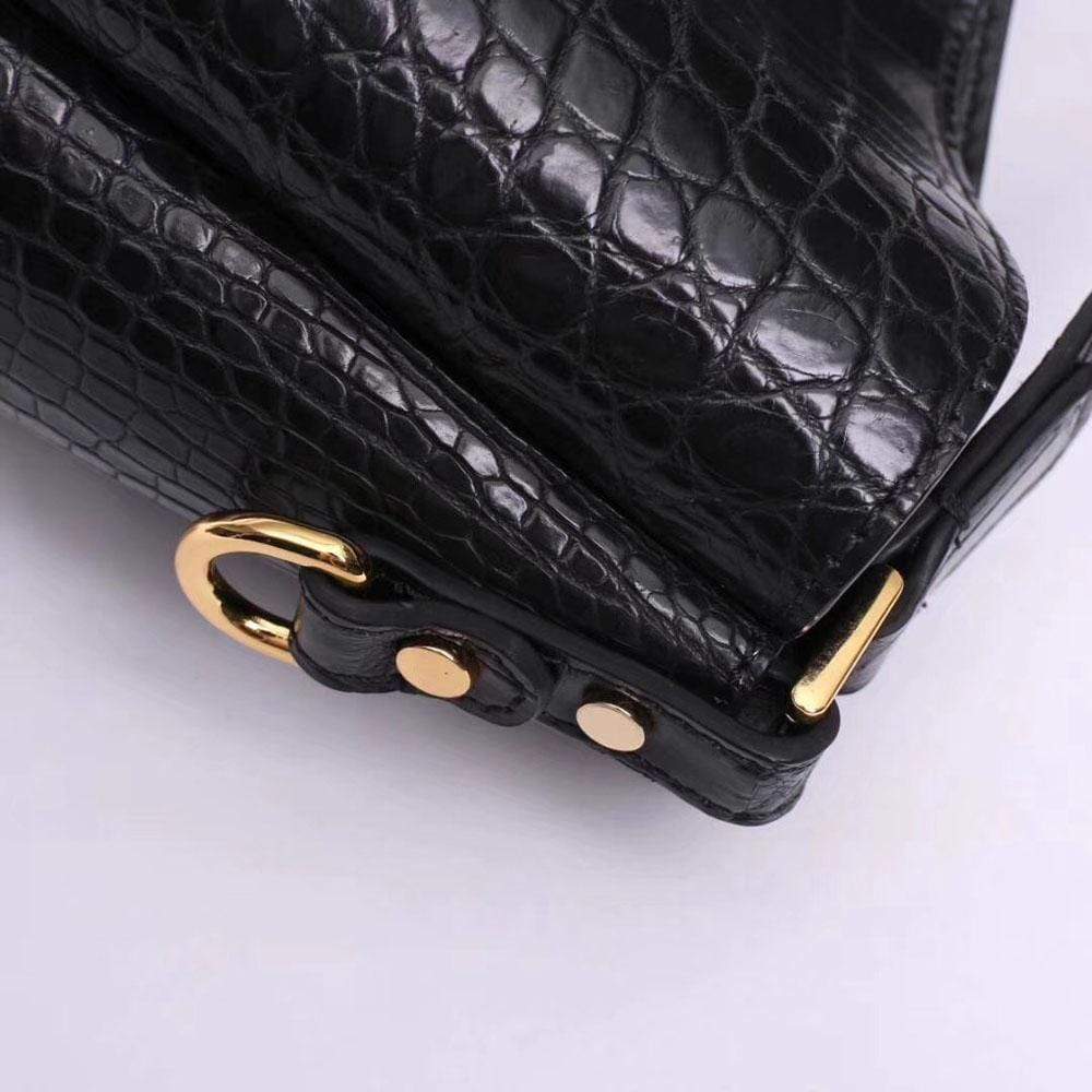 Black crocodile leather medium hobo bag and purse for women by Rossie Viren, featuring a stylish, textured design and shoulder strap.
