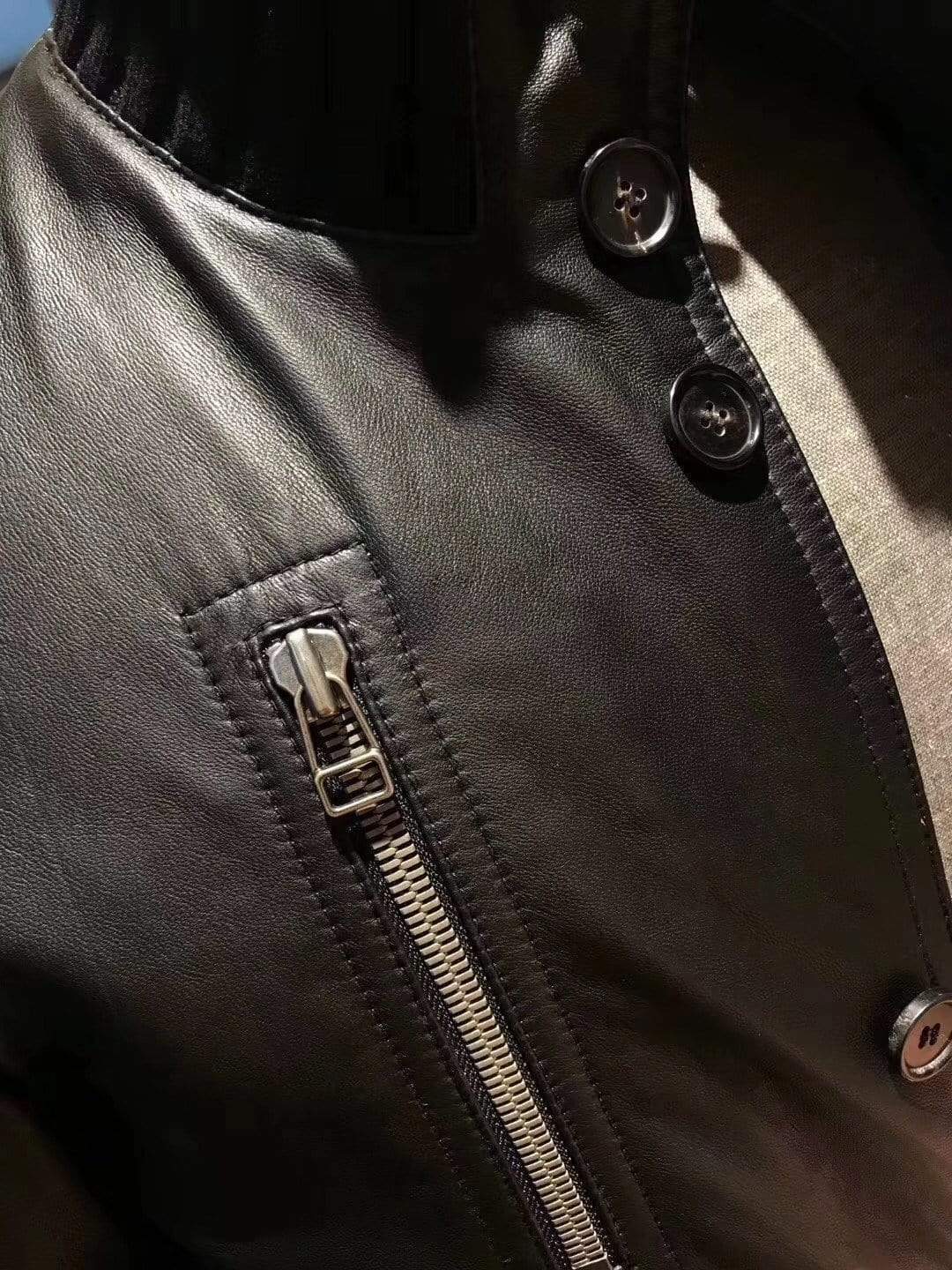 Black crocodile leather jacket by Rossie Viren with ribbed jersey cuffs and collar, showcasing a sleek and textured design.