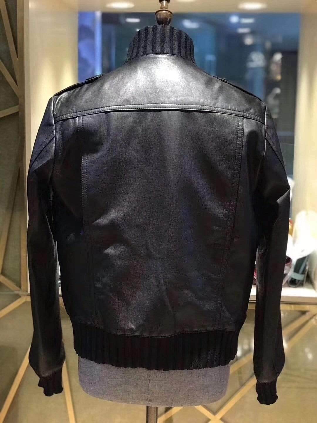 Black crocodile leather jacket with ribbed jersey cuffs and collar by Rossie Viren, featuring a sleek and stylish design.