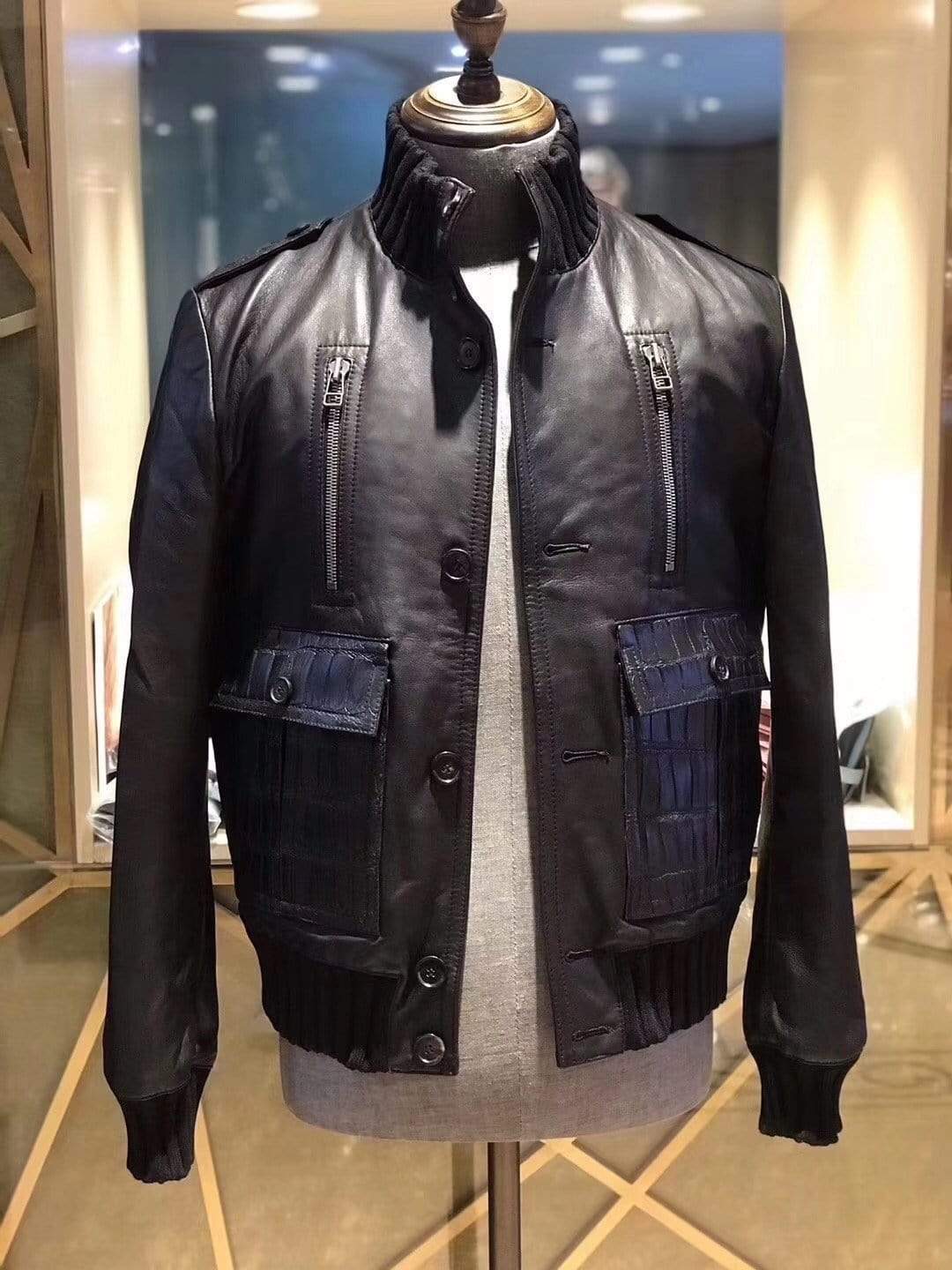 Black leather crocodile jacket by Rossie Viren with ribbed jersey cuffs and collar, showcasing sleek textured leather and classic design.