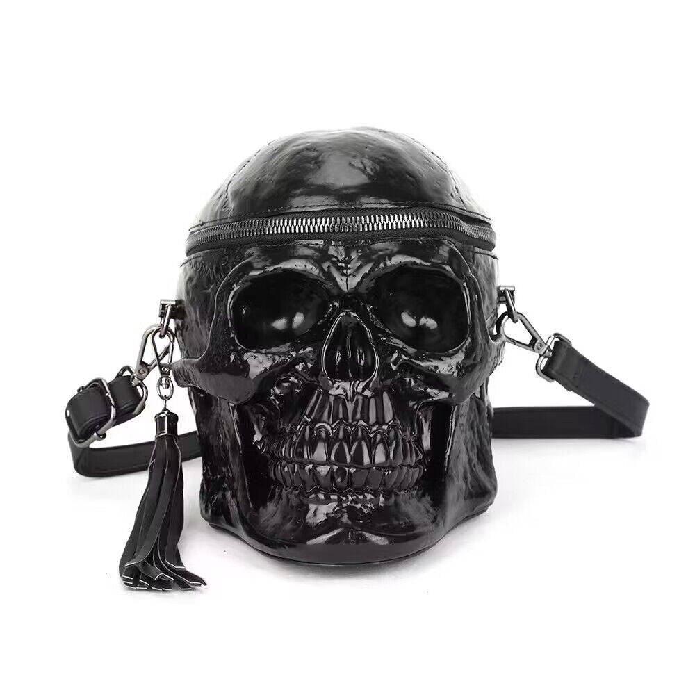 Black 3D skull cross body handle bag by Rossie Viren with mini handle and shoulder strap, featuring a stylish 3D skull design.