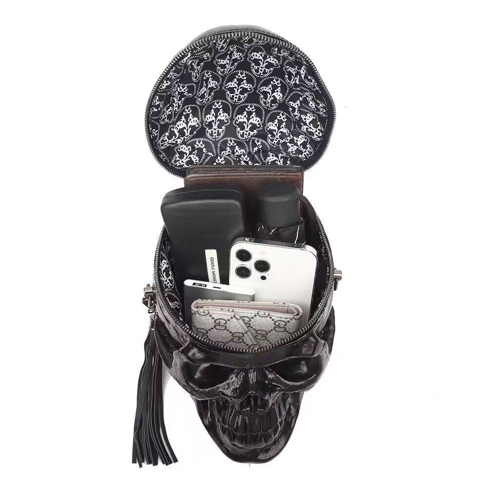 Black 3D skull cross body handle bag by Rossie Viren featuring a compact design and adjustable strap.