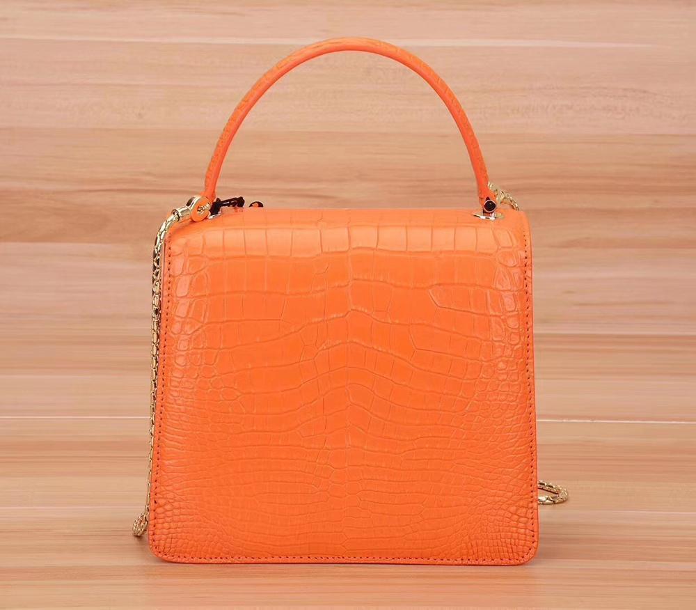 Rossie Viren genuine crocodile leather women’s chain crossbody handbag with flap closure and shoulder strap.