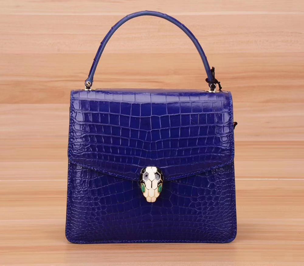 Genuine crocodile leather women's chain crossbody handbag with flap closure by Rossie Viren, stylish and elegant shoulder bag.