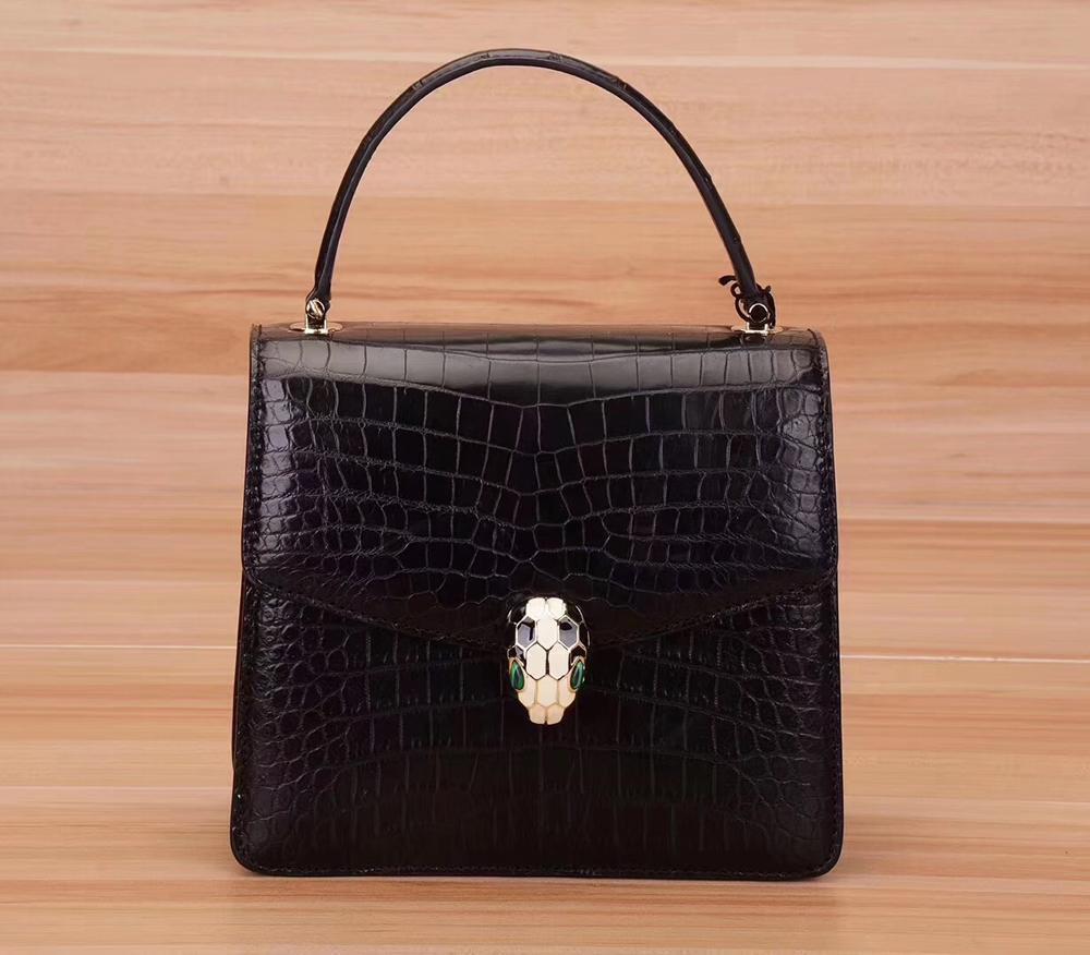 Rossie Viren crocodile leather women’s crossbody handbag with chain strap and flap closure, stylish and luxurious accessory.