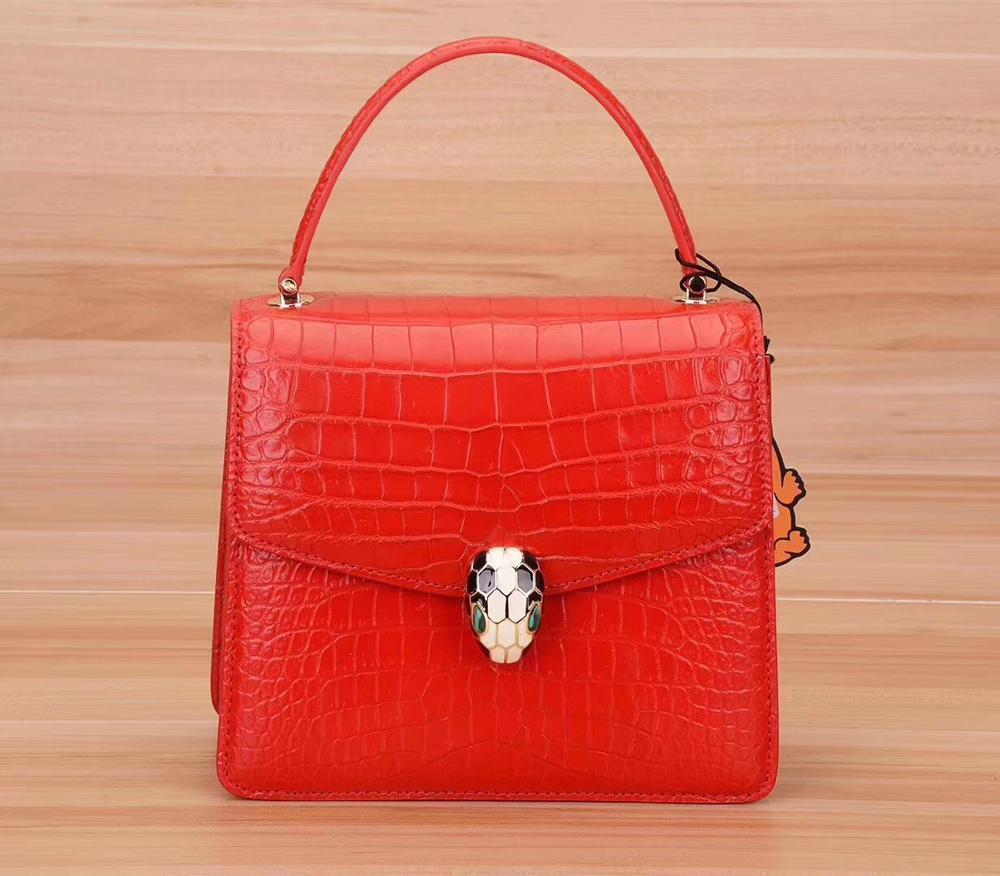 Rossie Viren genuine crocodile leather women's chain crossbody handbag with flap closure and elegant shoulder strap.