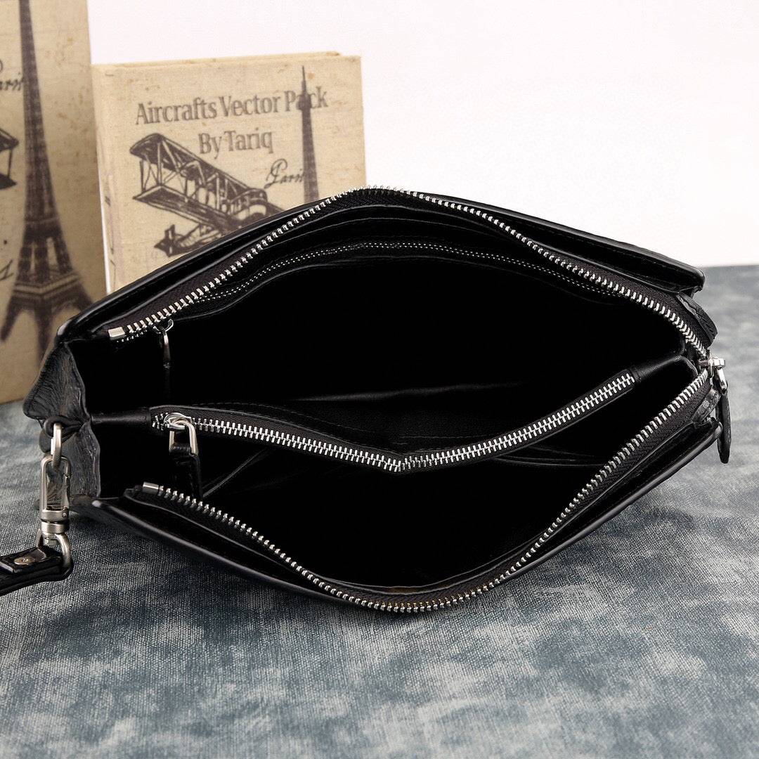 Rossie Viren crocodile leather clutch bag with large volume, designed for holding essentials, featuring a sleek, textured crocodile pattern.