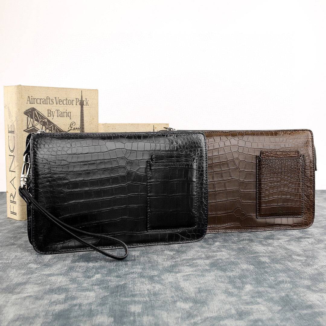 Rossie Viren crocodile leather clutch bag with large volume, designed for holding phone and essentials, featuring a textured crocodile pattern.
