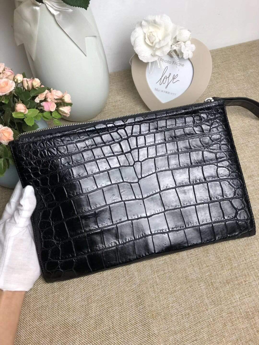 Rossie Viren crocodile belly leather large iPad clutch bag showing textured crocodile pattern and sleek design.