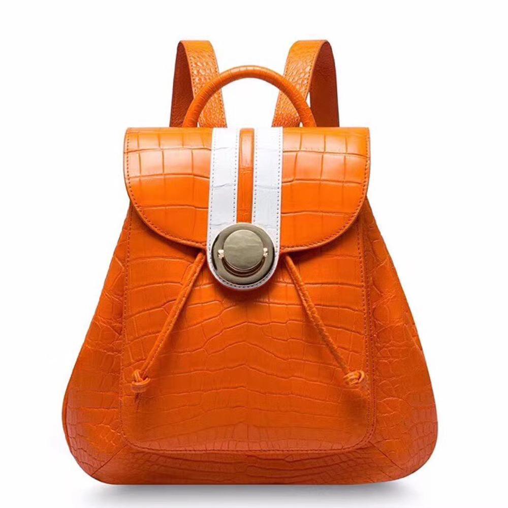 Crocodile belly leather women's handbag backpack by Rossie Viren, featuring a textured crocodile pattern and adjustable straps.