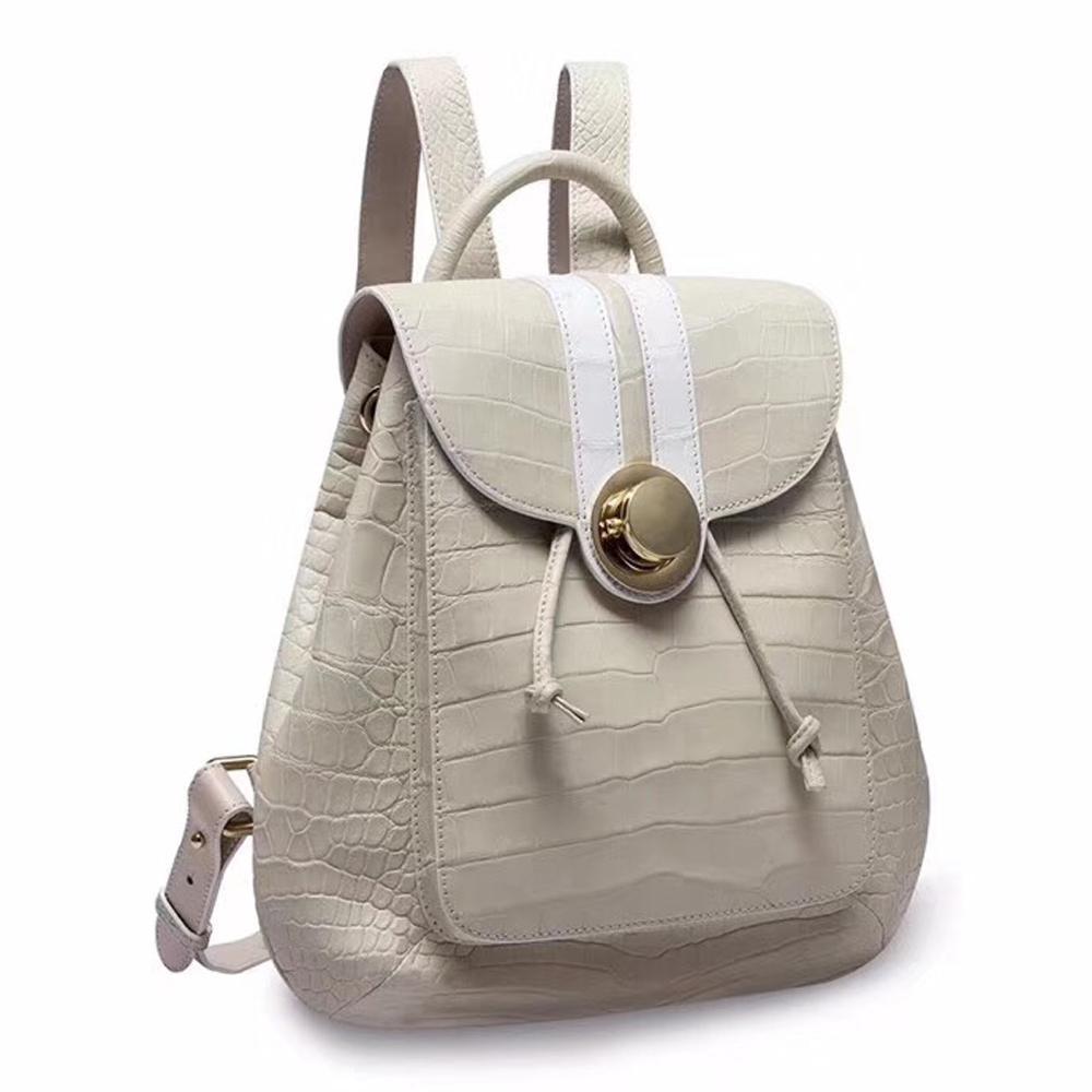 Rossie Viren crocodile belly leather women's backpack handbag with textured crocodile pattern and adjustable straps.