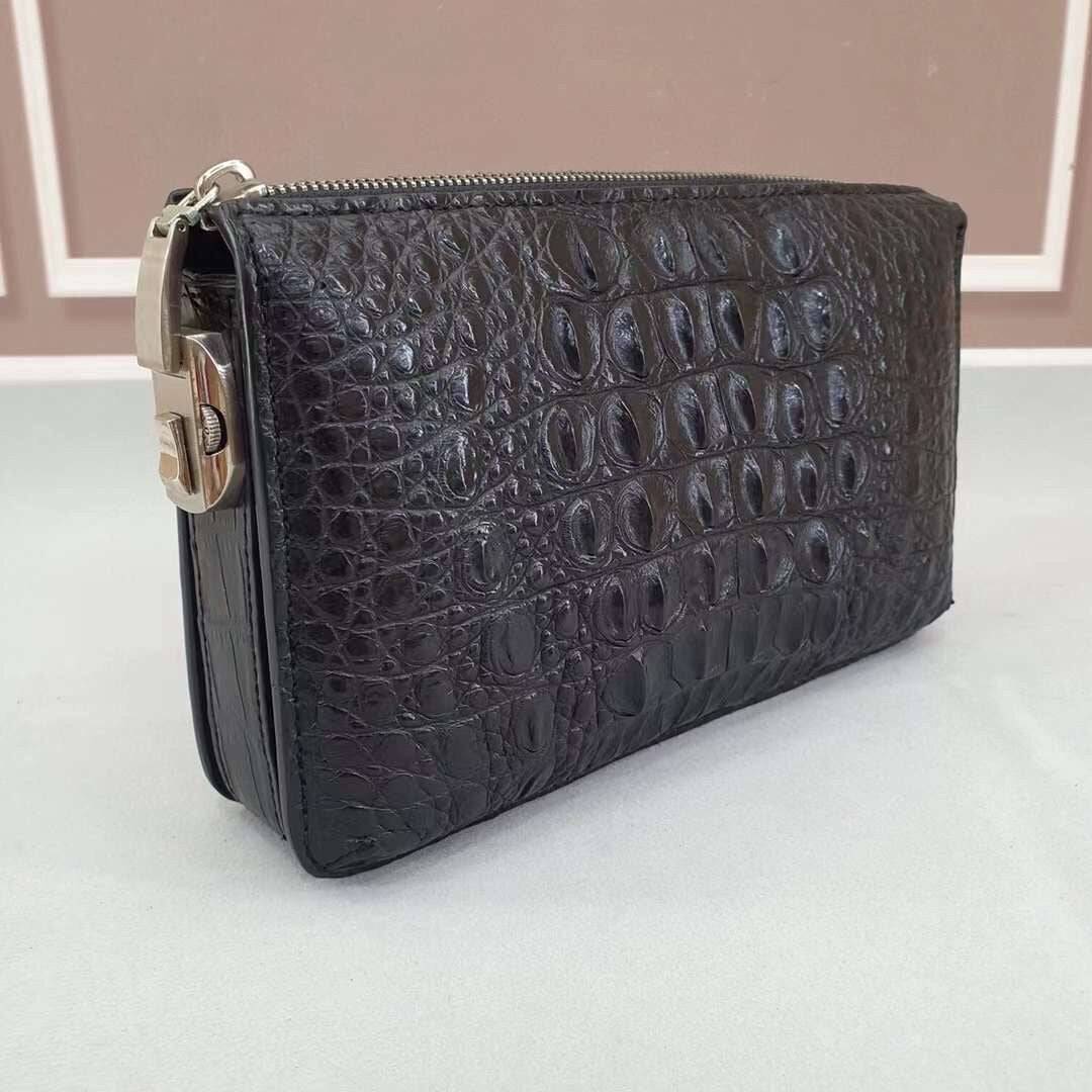 Crocodile Bone leather clutch bag by Rossie Viren with sleek design and textured pattern, featuring a fold-over flap and minimalist style.