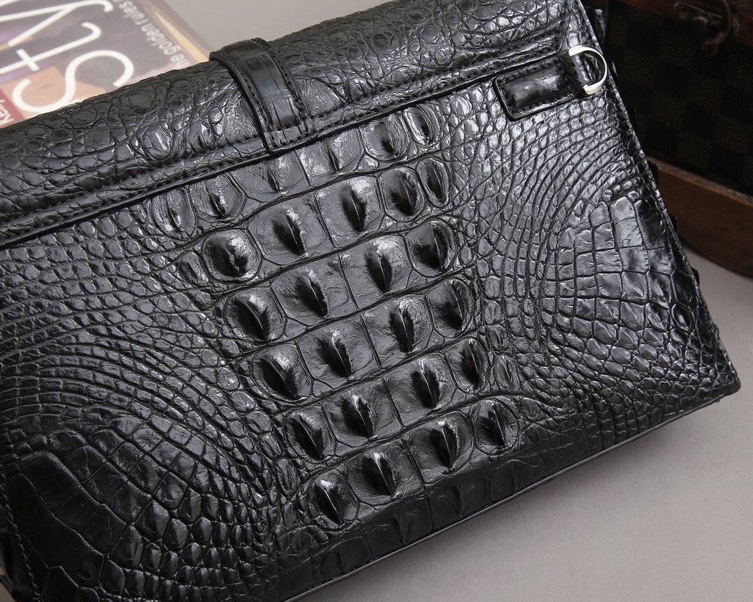 Rossie Viren crocodile bone leather clutch bag with a sleek design and textured crocodile pattern.