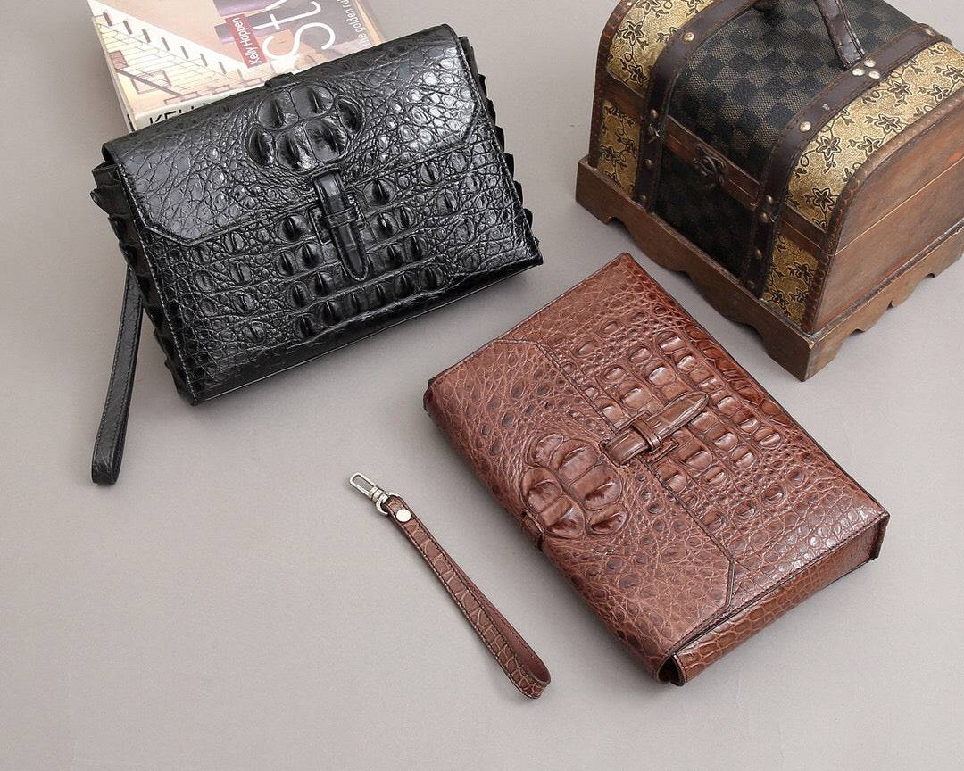 Rossie Viren crocodile bone leather clutch bag with textured crocodile pattern, elegant compact design and top zipper closure.
