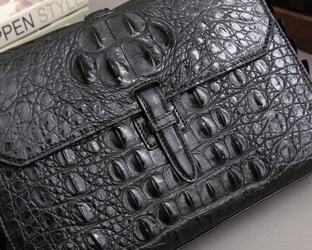 Rossie Viren crocodile bone leather clutch bag with textured crocodile pattern and sleek design, perfect for elegant occasions.