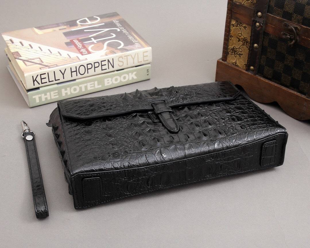 Rossie Viren crocodile bone leather clutch bag with textured crocodile skin finish and sleek design.