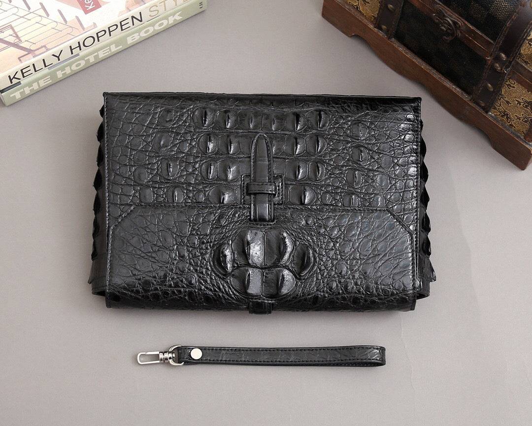 Rossie Viren crocodile bone leather clutch bag with textured crocodile pattern, sleek design, and compact size for elegant carry.