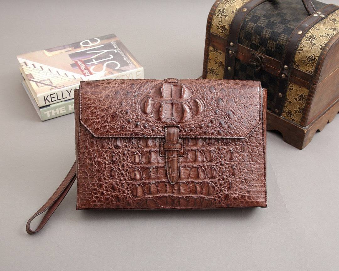 Rossie Viren crocodile bone leather clutch bag with sleek design and textured surface, perfect for elegant evening wear.