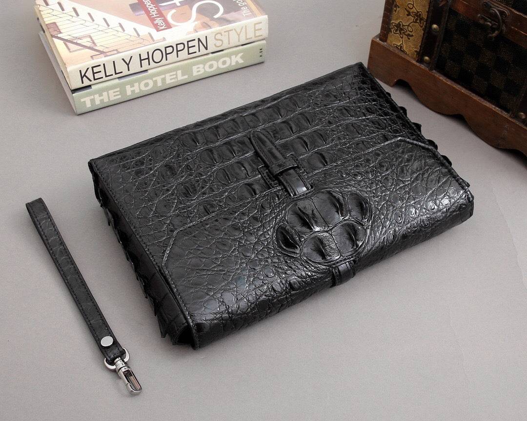Rossie Viren crocodile bone leather clutch bag with sleek design and textured finish, perfect for elegant evening occasions.
