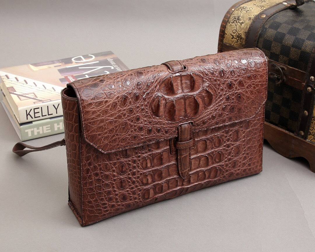 Rossie Viren crocodile bone leather clutch bag with textured crocodile pattern and sleek design for elegant style.