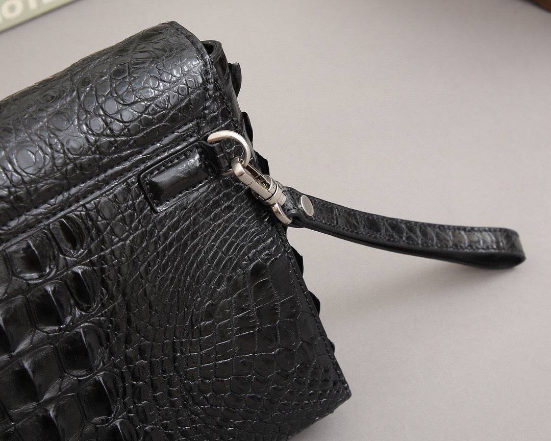 Rossie Viren crocodile bone leather clutch bag with textured crocodile pattern and sleek design, perfect for stylish occasions.