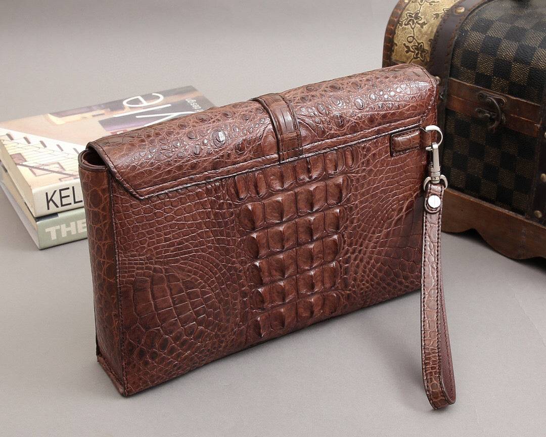 Rossie Viren crocodile bone leather clutch bag with a sleek design and textured crocodile skin finish.