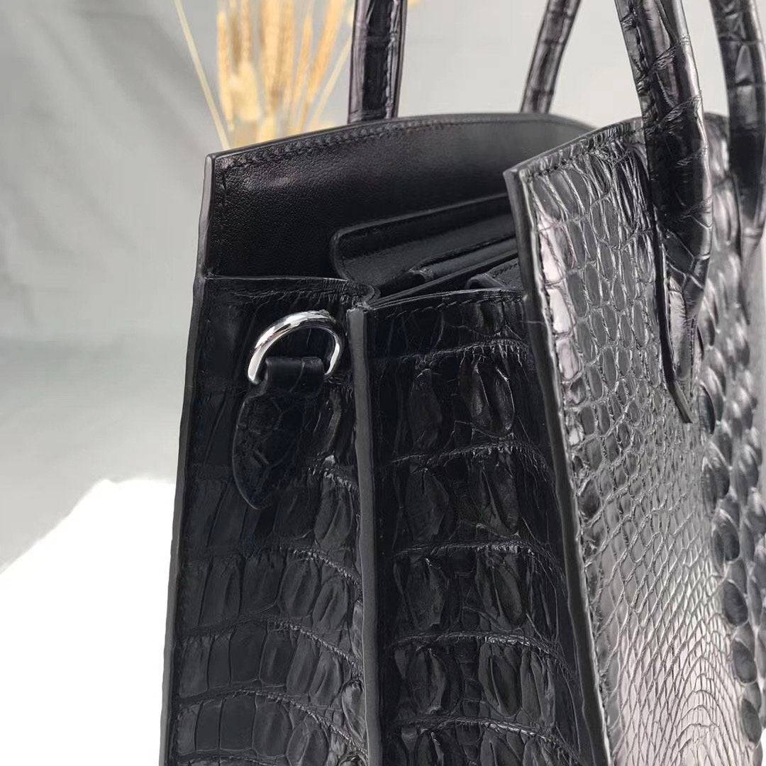 Crocodile Bone leather top handle handbag by Rossie Viren with elegant design and structured shape.