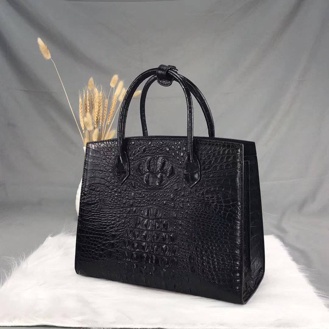 Rossie Viren crocodile bone leather handbag with top handle, featuring a sleek, textured crocodile pattern and elegant design.