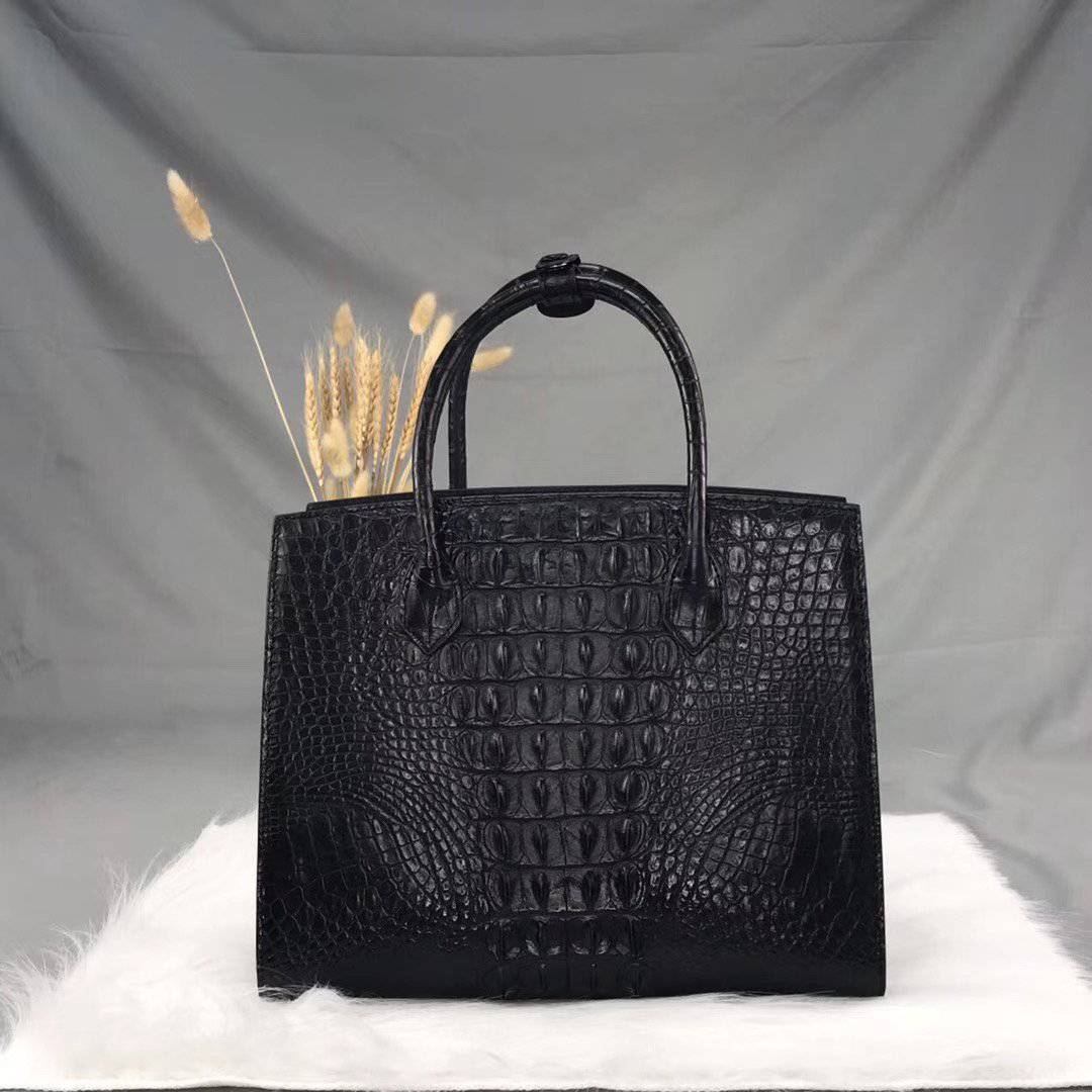Rossie Viren crocodile bone leather handbag with top handle, showcasing a sleek, textured design and elegant craftsmanship.