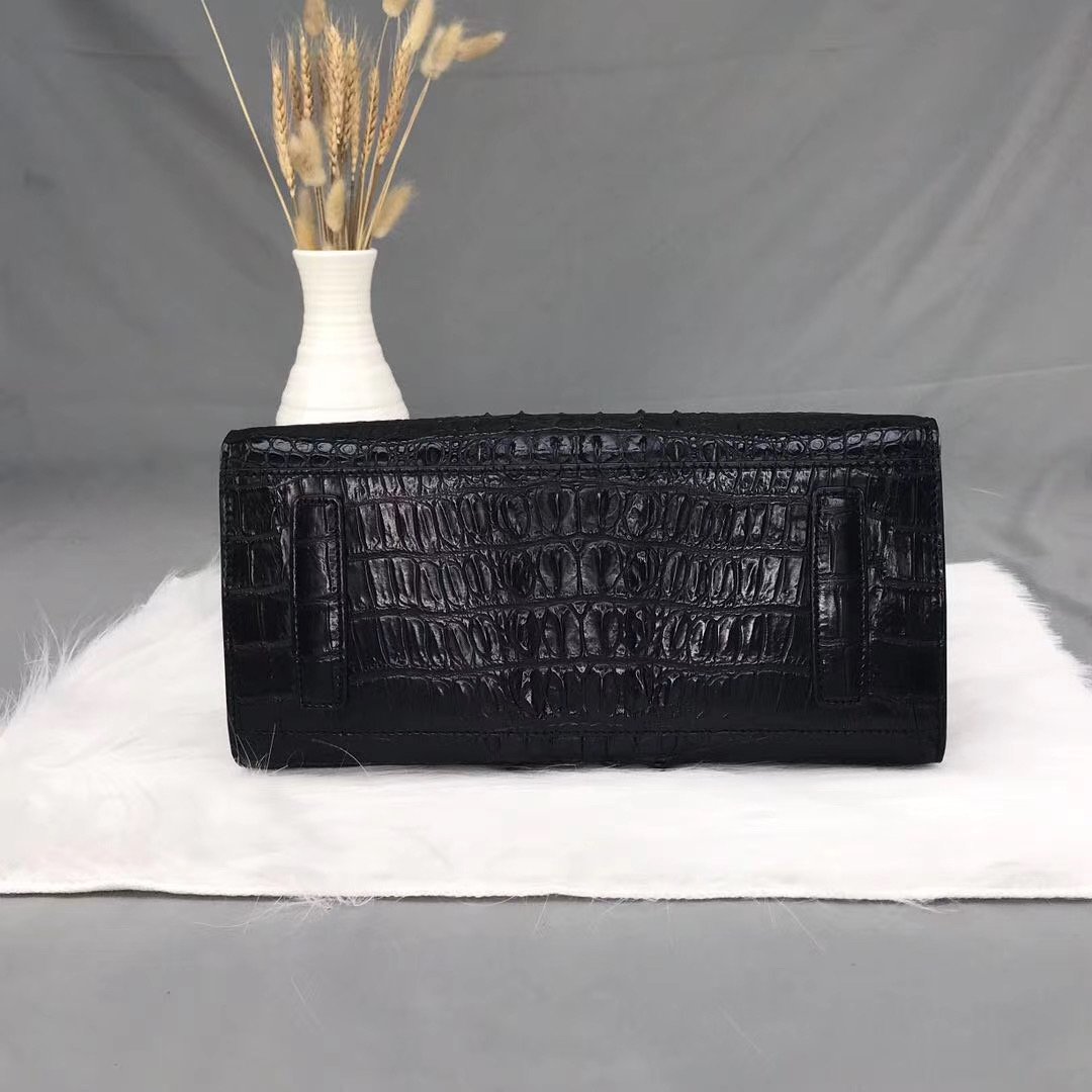 Rossie Viren crocodile bone leather handbag with top handle and sleek design, showcasing textured crocodile pattern and elegant craftsmanship.