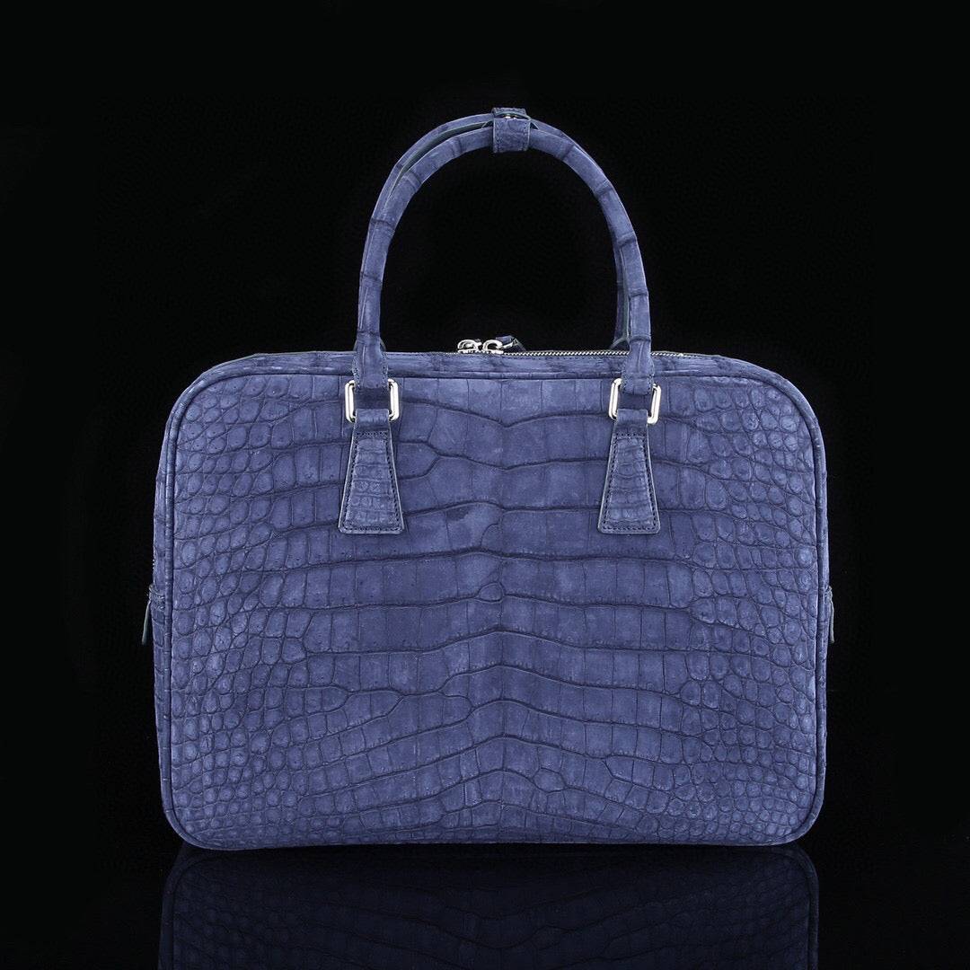 Blue genuine crocodile leather briefcase by Rossie Viren, featuring a sleek design and sturdy handle for professional use.