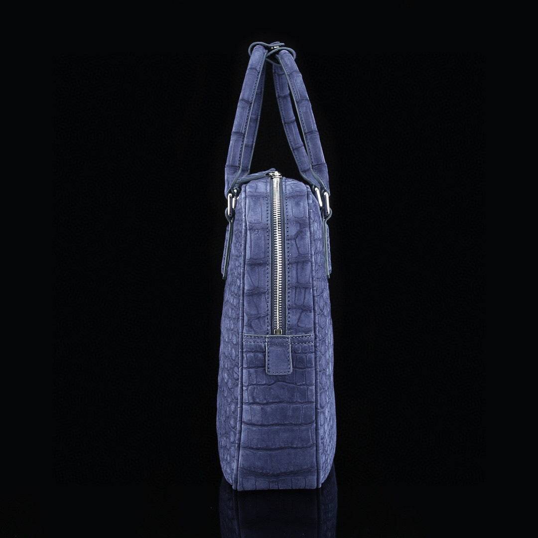 Blue genuine crocodile leather briefcase by Rossie Viren, featuring a sleek design and sturdy handles for professional use.