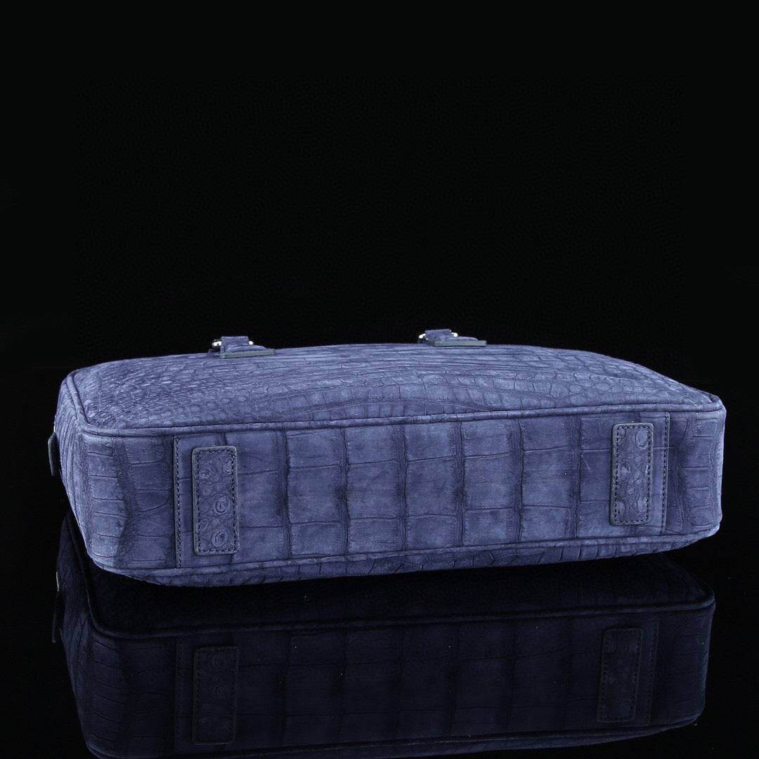 Blue genuine crocodile leather briefcase by Rossie Viren featuring a textured crocodile skin finish and sturdy handle.