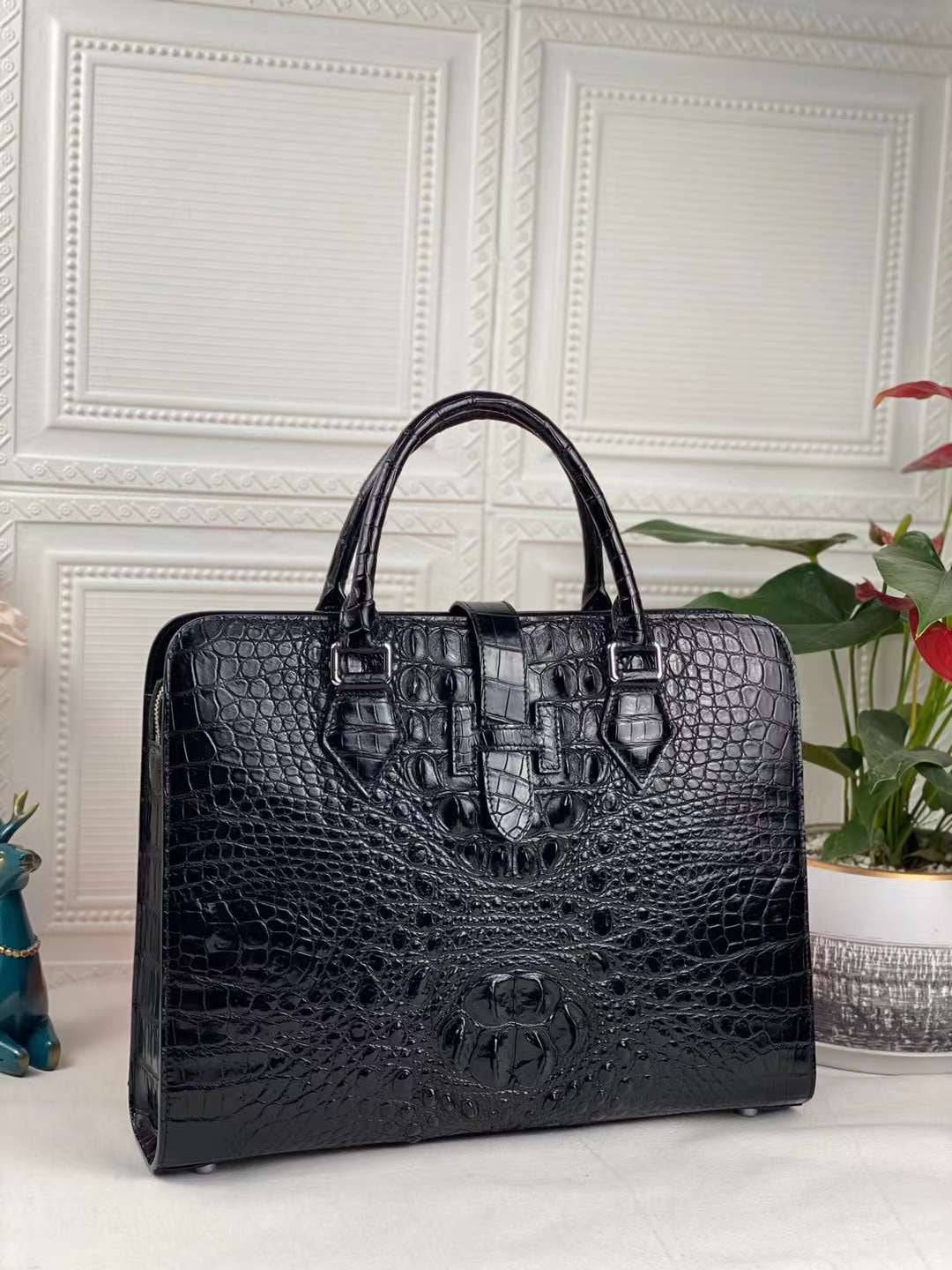 Black genuine crocodile leather briefcase by Rossie Viren, featuring a sleek design and sturdy handle for professional use.