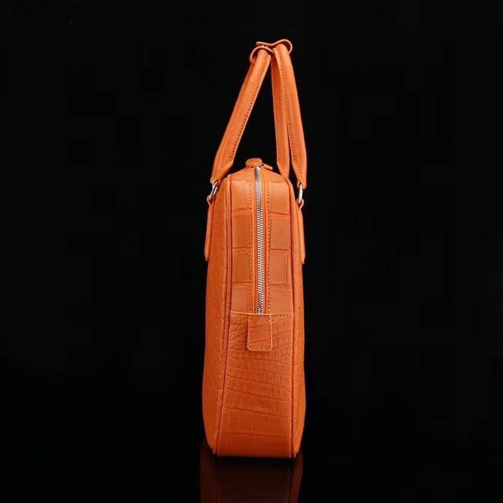 Orange genuine crocodile leather briefcase with sturdy handle and metal clasps, designed for laptops and professional use.