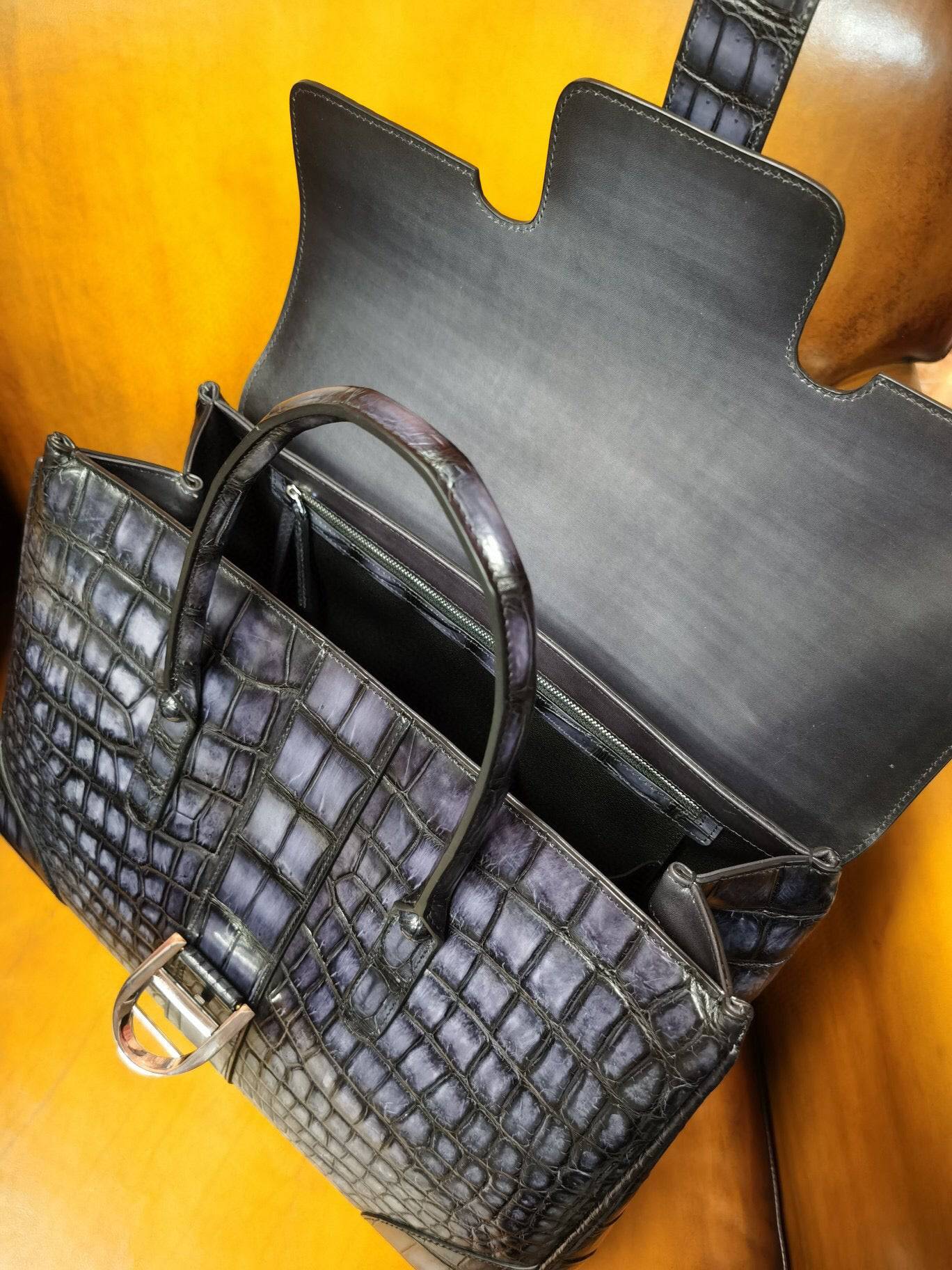 Vintage grey Rossie Viren crocodile leather briefcase with sturdy handle and metal clasp, designed for laptops and professional use.
