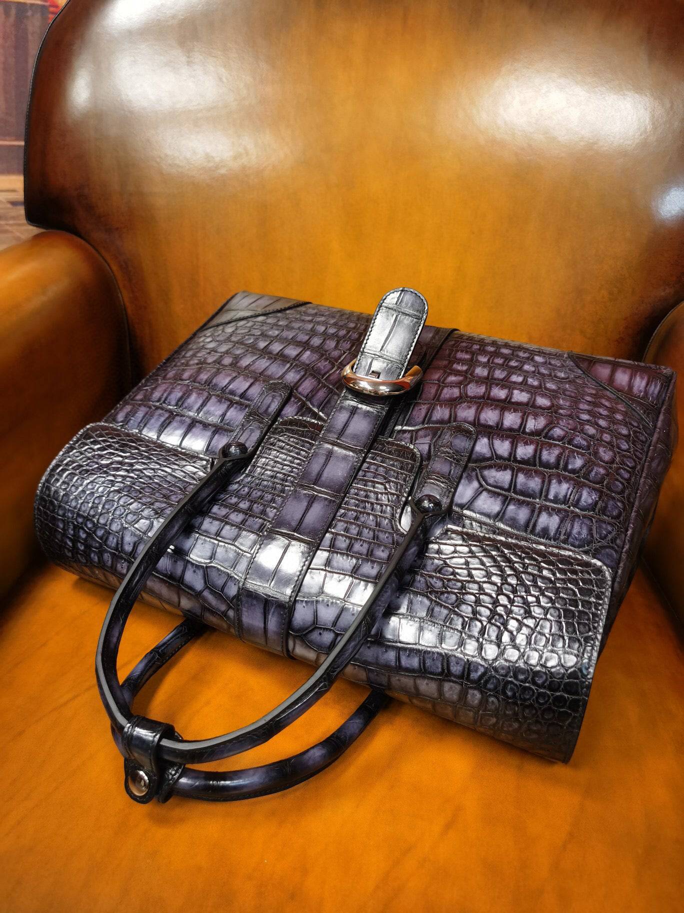 Vintage grey crocodile leather briefcase by Rossie Viren, featuring a sleek design and sturdy handle for professional use.