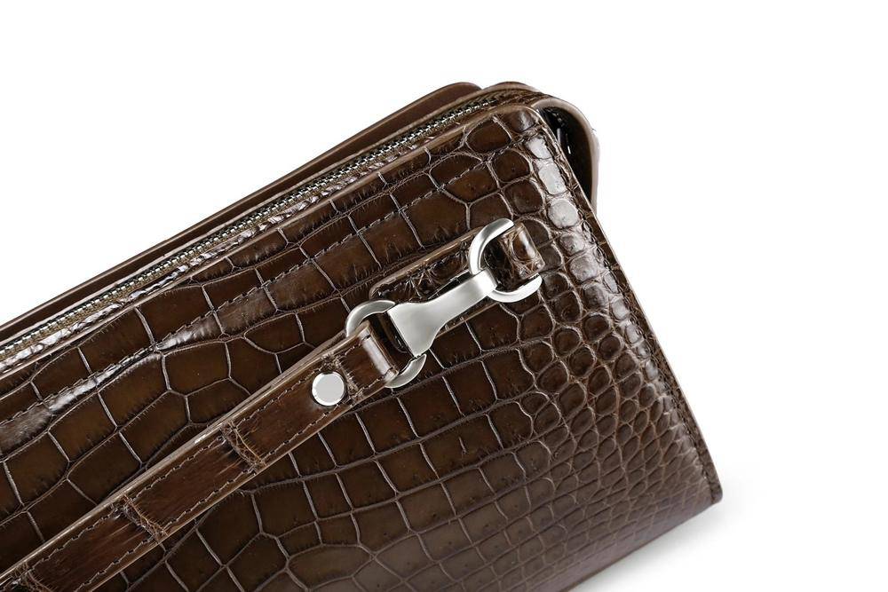 Rossie Viren crocodile belly leather clutch wallet with code lock and wrist strap, designed for stylish business use.