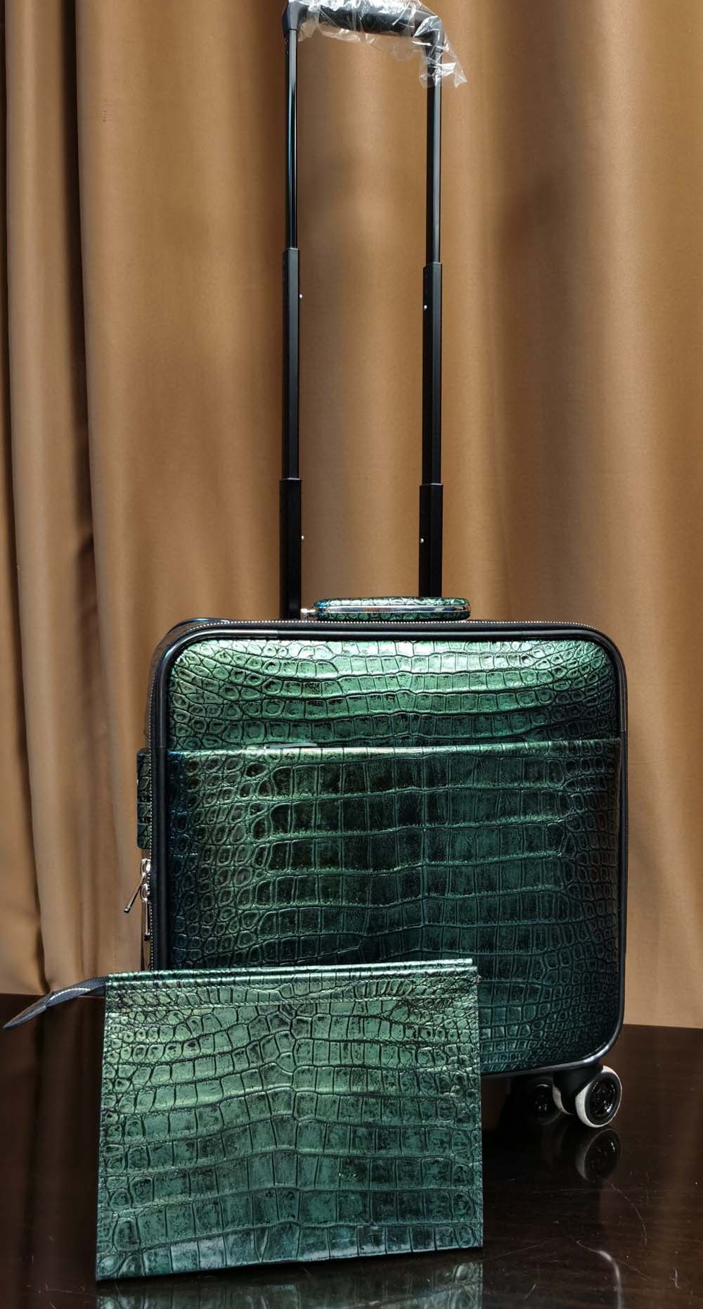 Dark green crocodile leather 15-inch mini carry-on suitcase by Rossie Viren, with textured crocodile pattern and sturdy handle.