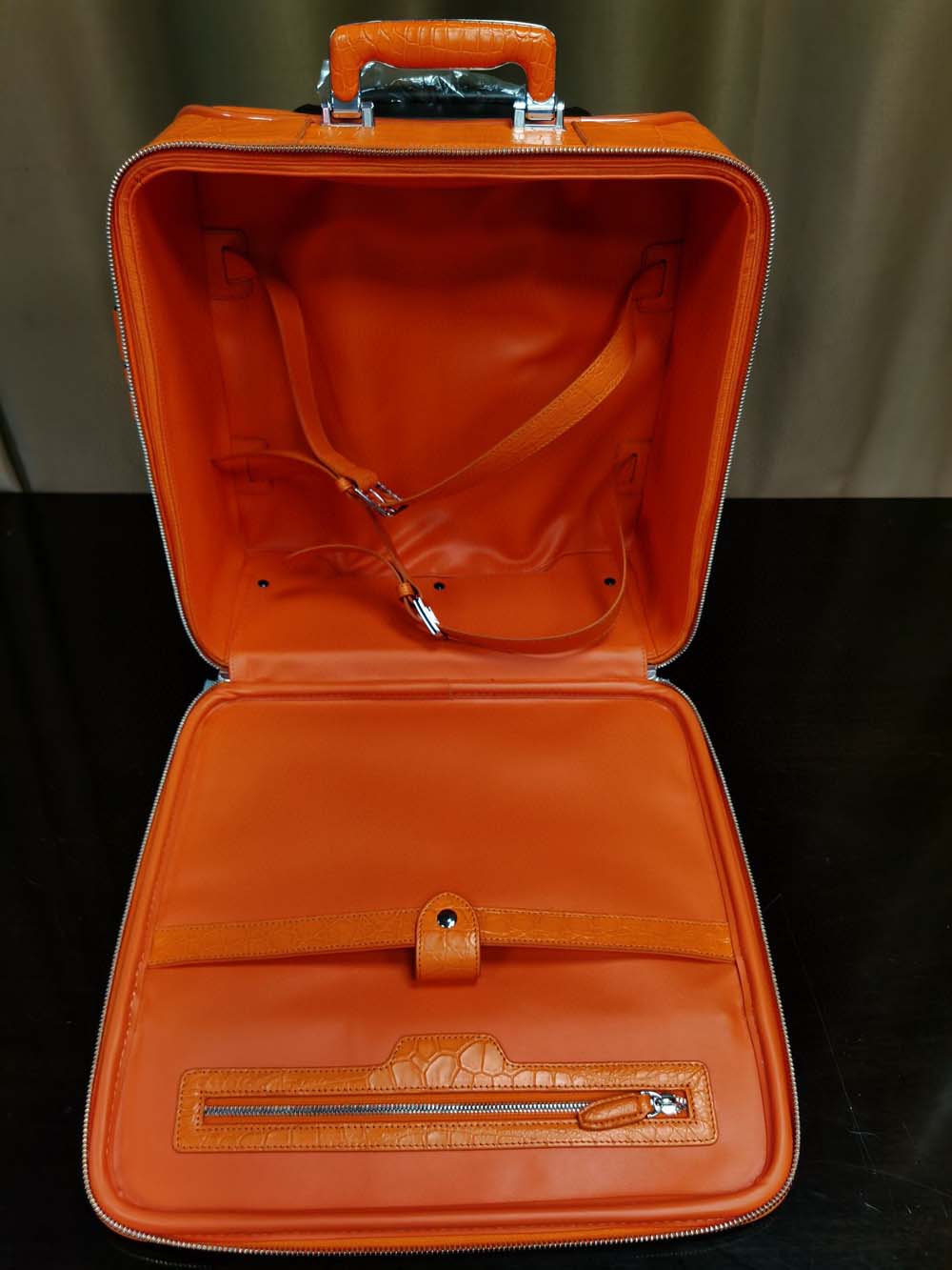 Orange crocodile leather 15-inch mini carry-on suitcase by Rossie Viren, with textured crocodile pattern and sturdy handle.