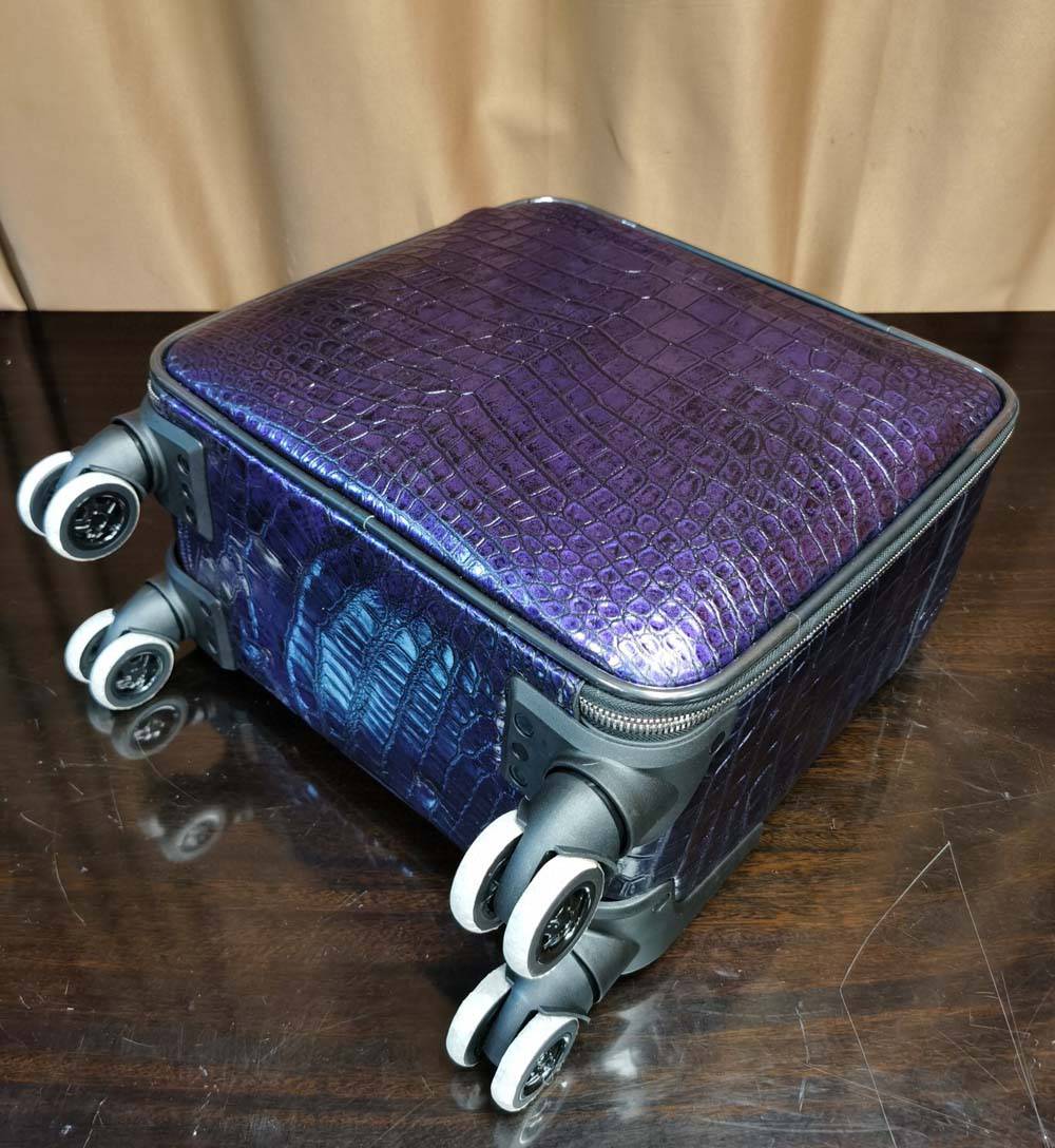 Purple Crocodile Leather 15-inch mini carry-on suitcase by Rossie Viren, featuring a textured crocodile pattern and sturdy handle.