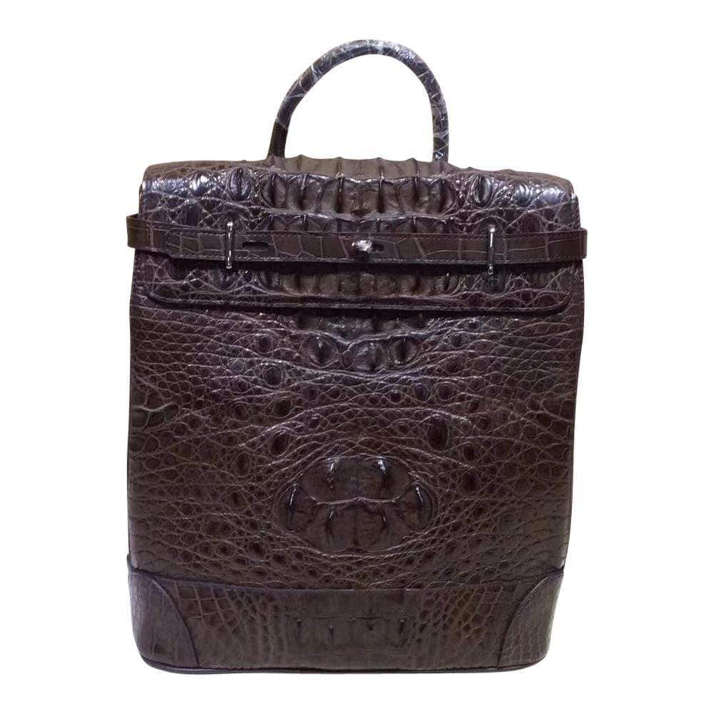 Rossie Viren crocodile leather backpack handbag with textured crocodile skin and adjustable straps on a neutral background.