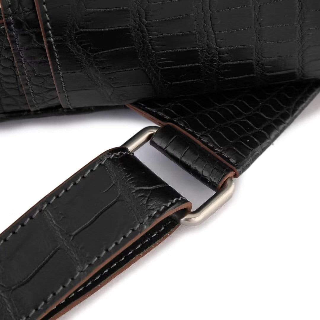 Black crocodile leather handbag for women by Rossie Viren, stylish backpack with textured crocodile pattern and top handle.