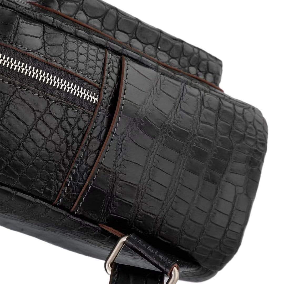 Black crocodile leather handbag for women by Rossie Viren, featuring a stylish backpack design with a sleek finish.