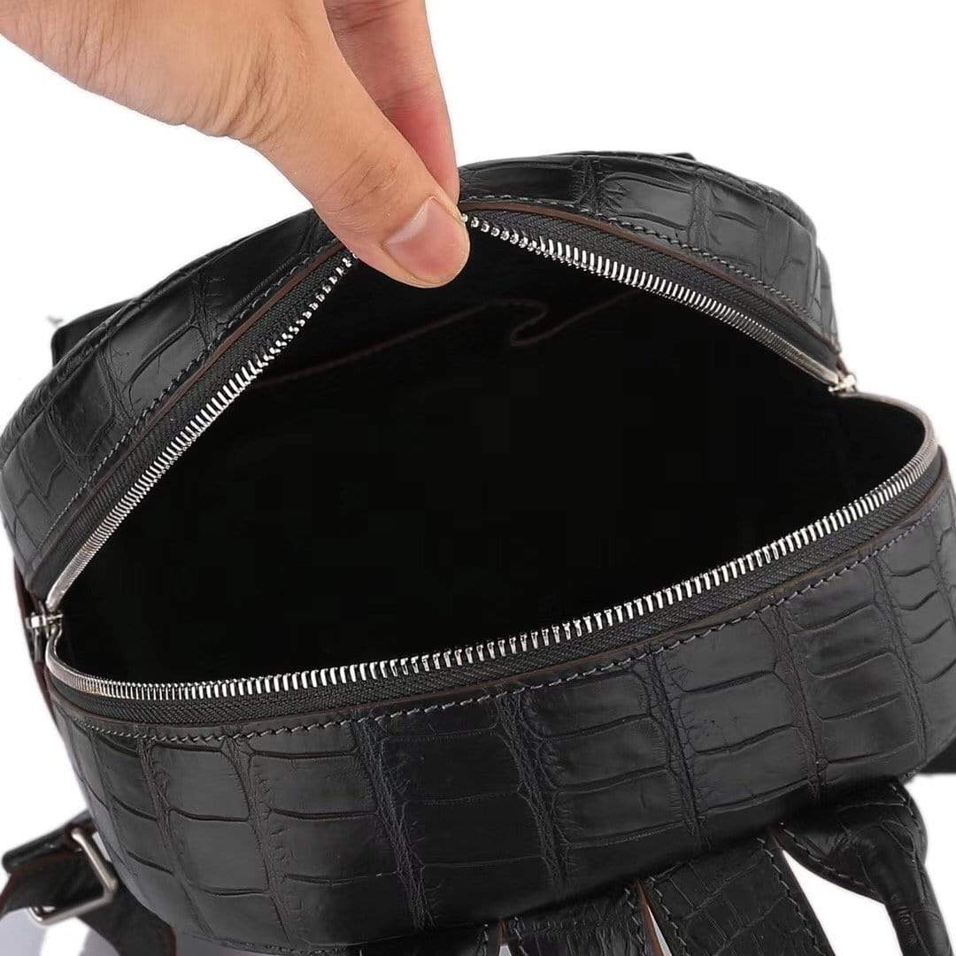 Black crocodile leather handbag for women by Rossie Viren, stylish backpack with textured crocodile pattern and sturdy straps.
