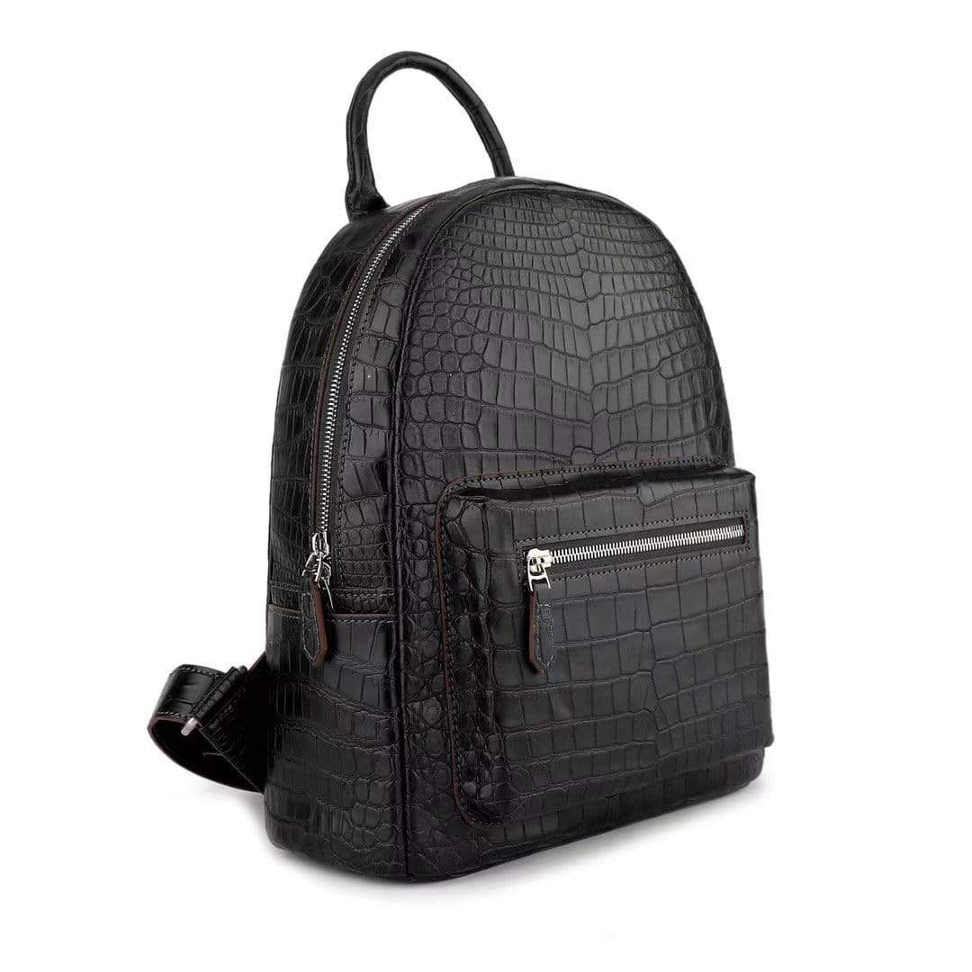 Black crocodile leather handbag for women by Rossie Viren, featuring a stylish and textured backpack design with adjustable straps.