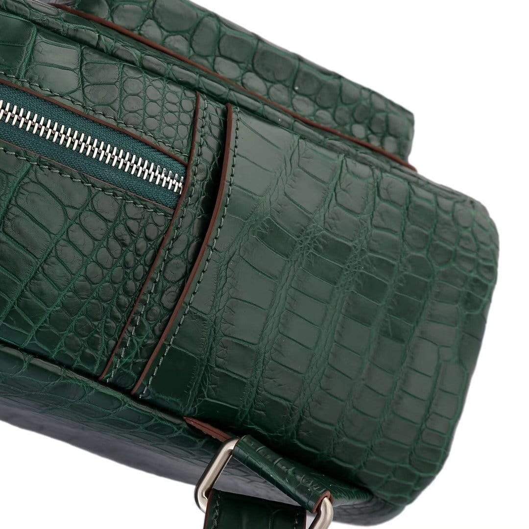Dark green crocodile leather backpack for women by Rossie Viren, featuring a stylish handbag design with textured leather.