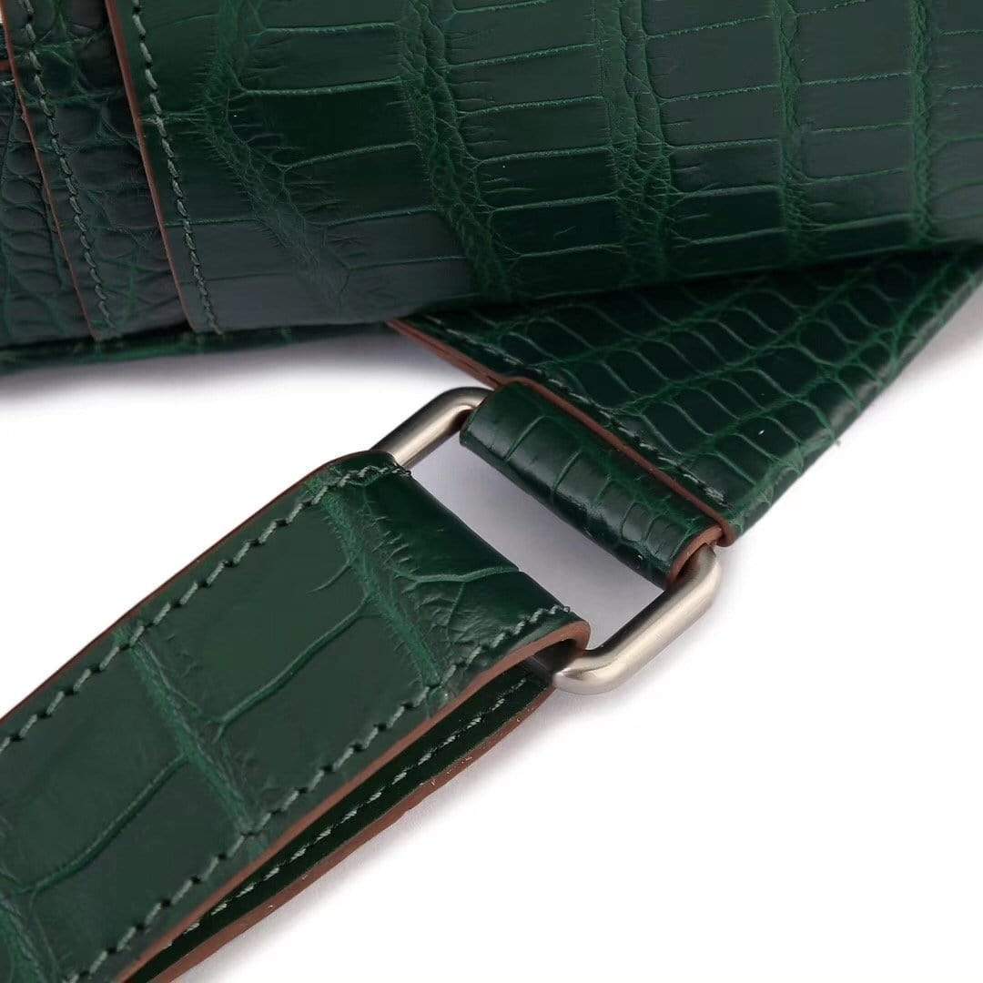 Dark green crocodile leather handbag for women by Rossie Viren, stylish backpack with textured crocodile pattern and adjustable straps.