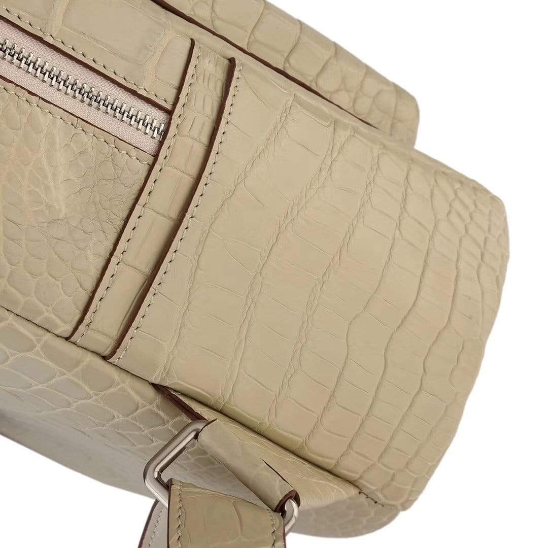 Cream crocodile leather backpack handbag for women by Rossie Viren, featuring a textured crocodile pattern and stylish design.
